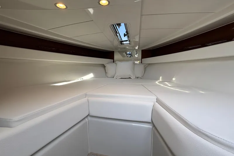  Yacht Photos Pics Luxurious interior cabin of 2025 Riva Aquariva Special yacht, featuring elegant white upholstery.