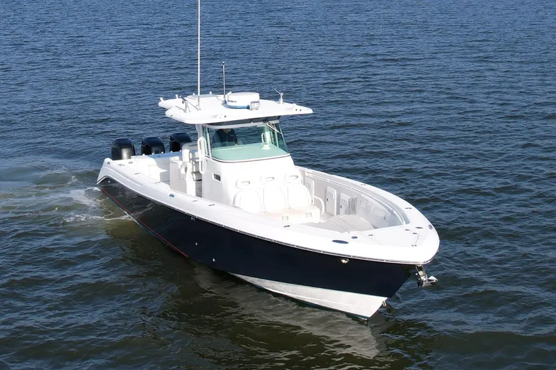 Salt Shaker Yacht Photos Pics 2008 Everglades 350 Center Console boat cruising on open water.