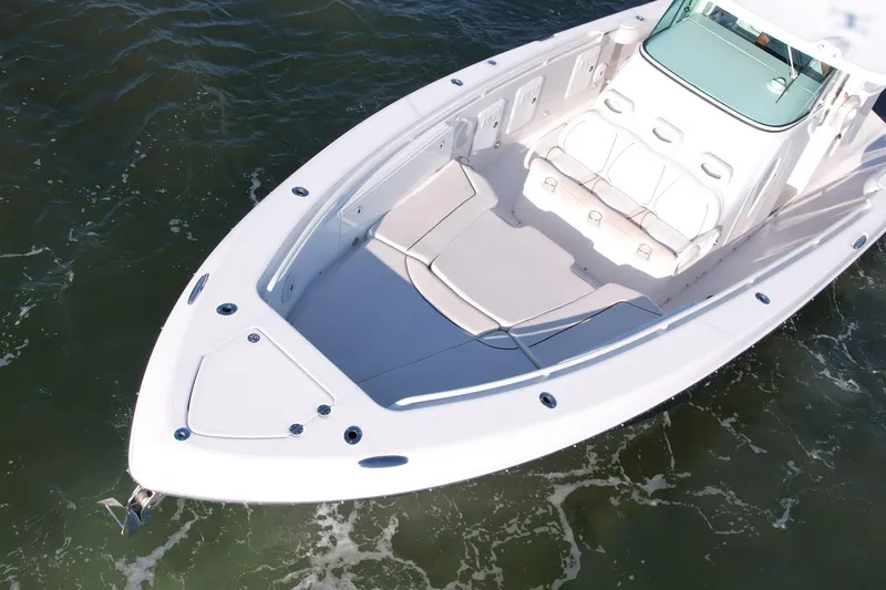 Salt Shaker Yacht Photos Pics 2008 Everglades 350 Center Console boat on water, showcasing spacious deck and seating.