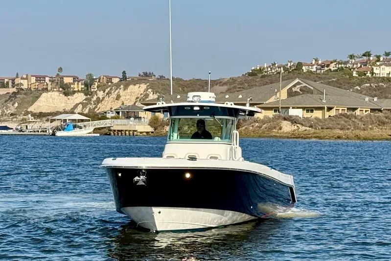 Salt Shaker Yacht Photos Pics 2008 Everglades 350 Center Console boat cruising on a scenic waterway.