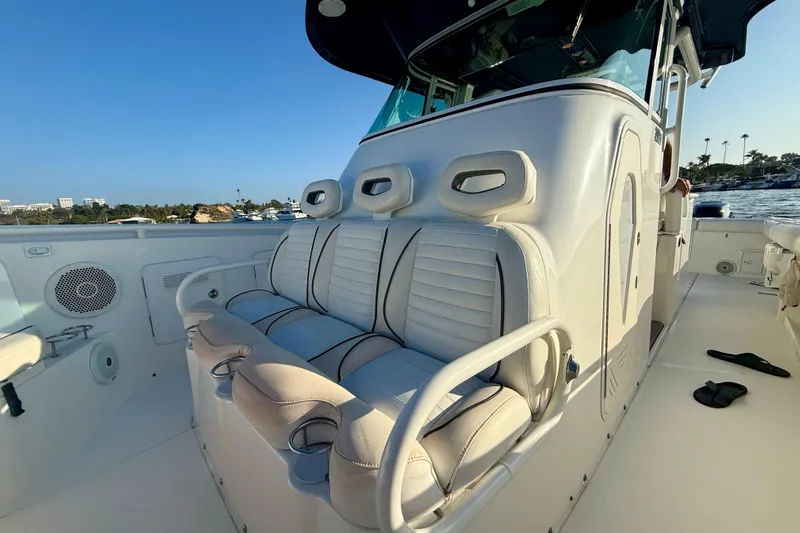 Salt Shaker Yacht Photos Pics 2008 Everglades 350 Center Console boat interior with cushioned seating and ocean view.