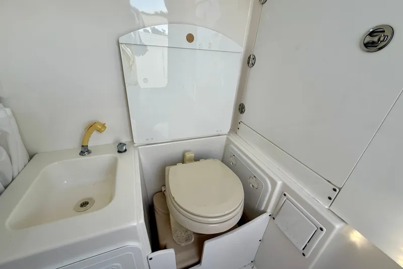 Salt Shaker Yacht Photos Pics 2008 Everglades 350 Center Console boat bathroom with sink and toilet.