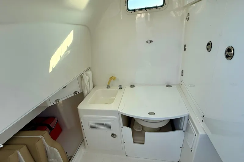Salt Shaker Yacht Photos Pics 2008 Everglades 350 Center Console boat interior with sink and toilet.