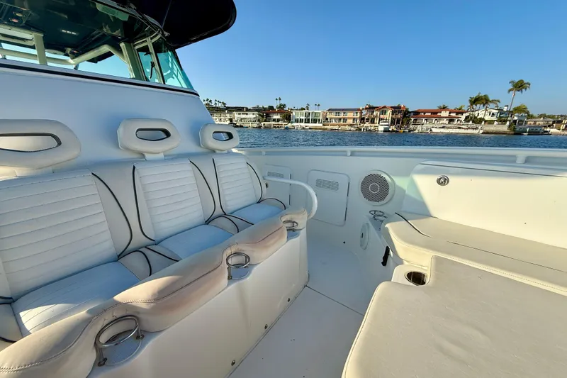 Salt Shaker Yacht Photos Pics 2008 Everglades 350 Center Console boat interior with white seating, coastal view.