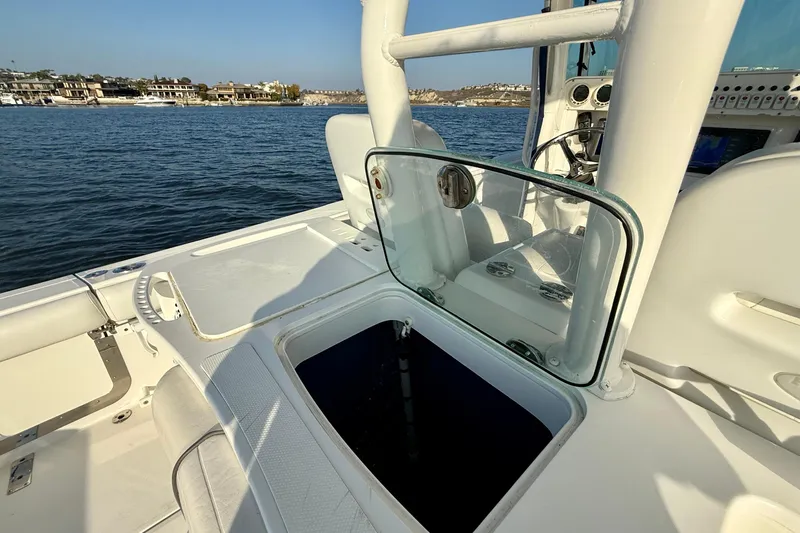 Salt Shaker Yacht Photos Pics 2008 Everglades 350 Center Console boat interior with open hatch, on calm water.