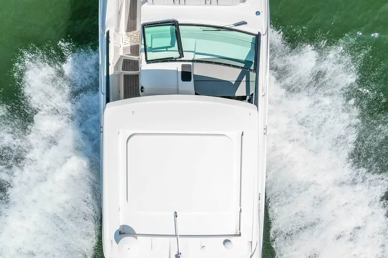 Sail Pending Yacht Photos Pics 2022 Sea Ray Sundancer 320 Outboard cruising on water, aerial view.