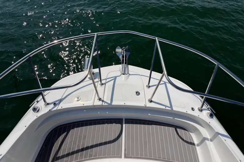 Sail Pending Yacht Photos Pics Bow of 2022 Sea Ray Sundancer 320 Outboard on water.