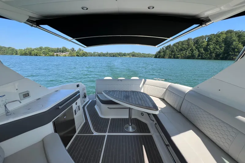 Sail Pending Yacht Photos Pics Luxurious 2022 Sea Ray Sundancer 320 Outboard interior with lake view and elegant seating.