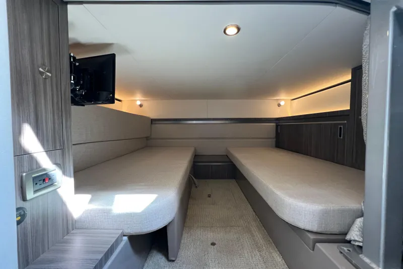 Sail Pending Yacht Photos Pics 2022 Sea Ray Sundancer 320 Outboard cabin interior with twin beds and modern lighting.