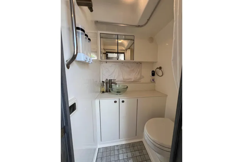 Sail Pending Yacht Photos Pics 2022 Sea Ray Sundancer 320 Outboard bathroom with modern fixtures and sleek design.