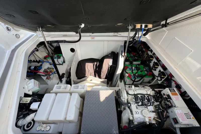 Sail Pending Yacht Photos Pics 2022 Sea Ray Sundancer 320 Outboard engine compartment with batteries and mechanical components.