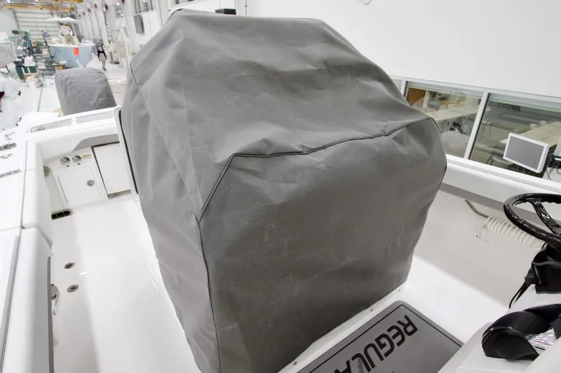 31-406 Yacht Photos Pics 2026 Regulator 31 boat interior with covered console in a manufacturing facility.