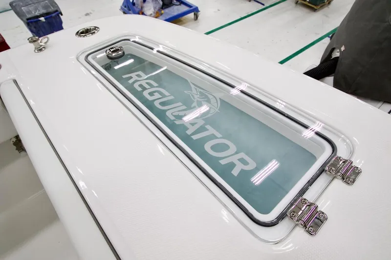 31-406 Yacht Photos Pics 2026 Regulator 31 boat deck with logo and sleek design.