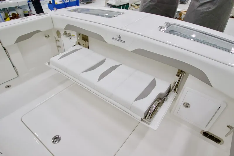 31-406 Yacht Photos Pics 2026 Regulator 31 boat with foldable seating and storage compartment.