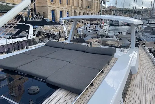  Yacht Photos Pics Luxurious 2017 Hanse 588 yacht with spacious deck and modern design in marina setting.