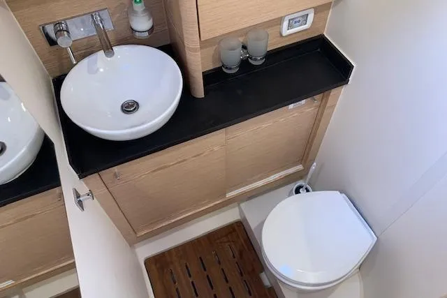  Yacht Photos Pics Modern bathroom in 2017 Hanse 588 yacht with sink and toilet.