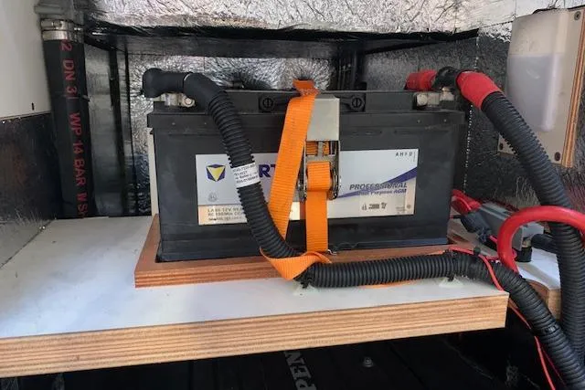  Yacht Photos Pics Battery installation in a 2017 Hanse 588 yacht, secured with an orange strap.