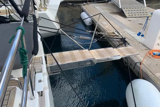  Yacht Photos Pics Gangway of 2017 Hanse 588 yacht docked at marina with safety ropes.