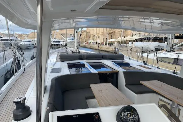  Yacht Photos Pics Luxurious 2017 Hanse 588 yacht with spacious deck and modern seating in a marina.