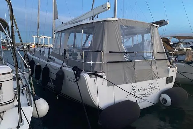  Yacht Photos Pics Sailing yacht Hanse 588, 2017 model, docked with protective cover and fenders.