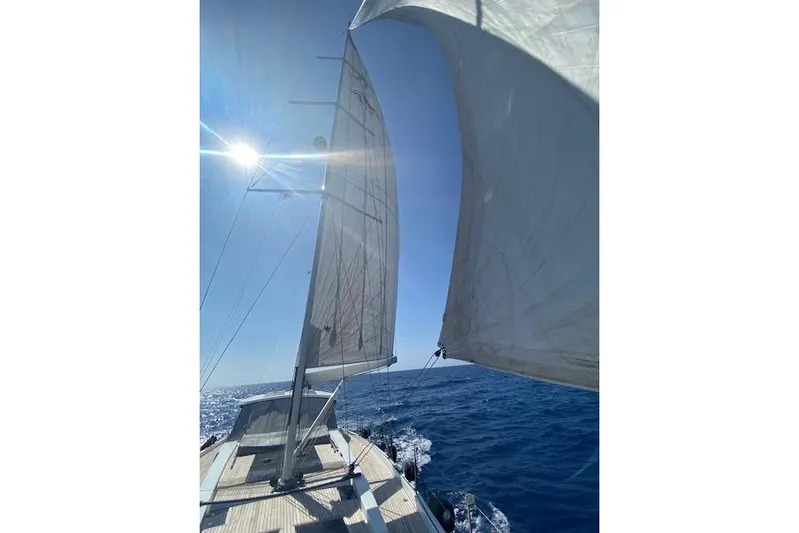  Yacht Photos Pics Sailing on a 2017 Hanse 588 yacht under clear blue skies.