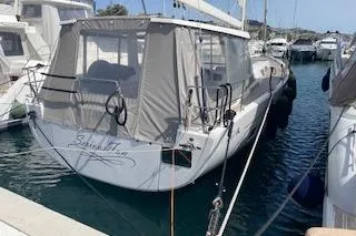  Yacht Photos Pics Hanse 588 yacht, 2017 model, docked in a marina with protective canopy.