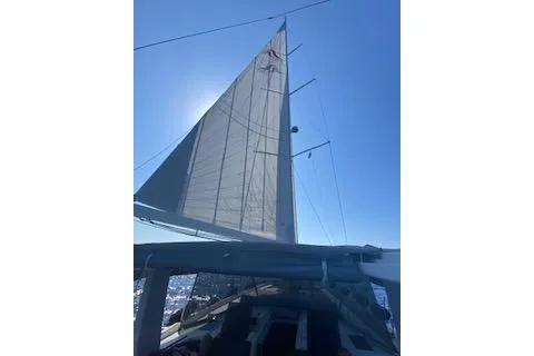  Yacht Photos Pics Sailing yacht Hanse 588, 2017 model, with sails unfurled against a clear blue sky.