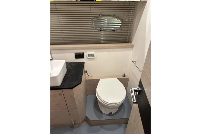  Yacht Photos Pics Modern bathroom in 2017 Rio Yachts Sport Coupe 44 with sleek design and compact layout.