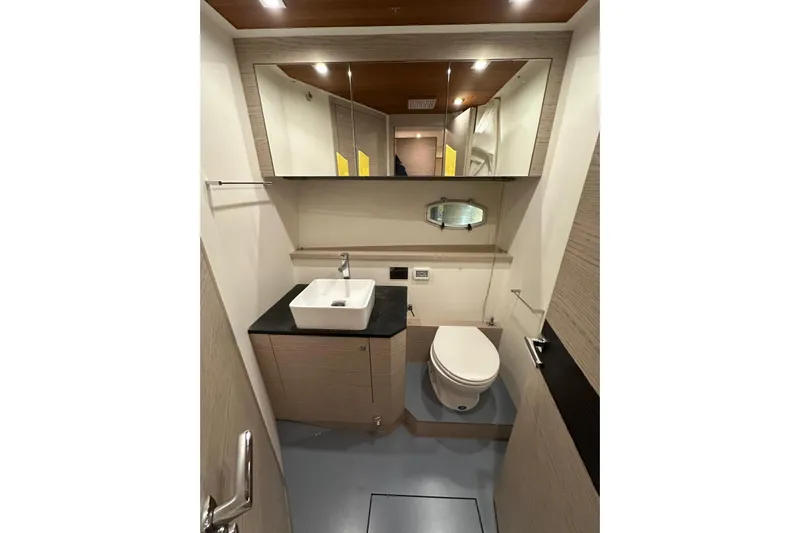  Yacht Photos Pics Luxurious bathroom in 2017 Rio Yachts Sport Coupe 44, featuring modern fixtures and elegant design.