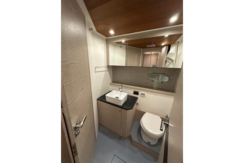  Yacht Photos Pics Luxurious bathroom in 2017 Rio Yachts Sport Coupe 44, featuring modern fixtures and elegant design.