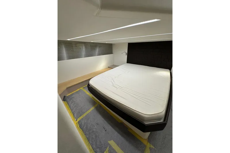  Yacht Photos Pics Luxurious bedroom interior of 2017 Rio Yachts Sport Coupe 44 with modern design elements.