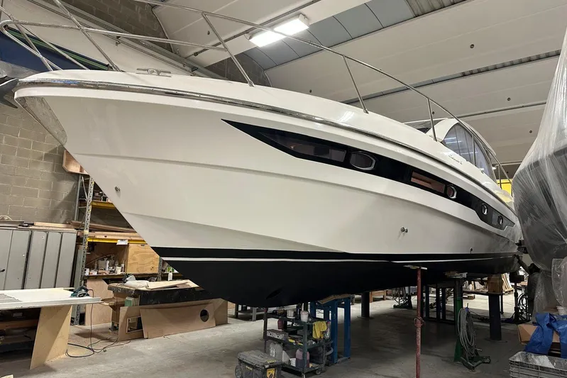  Yacht Photos Pics 2017 Rio Yachts Sport Coupe 44 in a workshop, showcasing sleek design and craftsmanship.