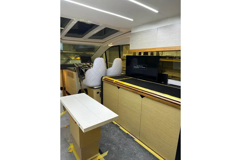  Yacht Photos Pics Interior of 2017 Rio Yachts Sport Coupe 44 with modern helm and seating.