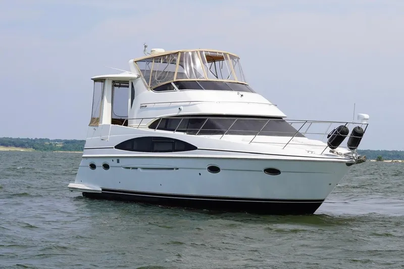  Yacht Photos Pics 2003 Carver 396 Motor Yacht cruising on open water, showcasing sleek design and luxury features.