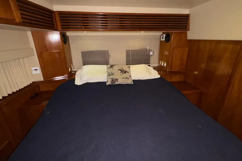  Yacht Photos Pics Interior of 2003 Carver 396 Motor Yacht with cozy bed and wooden accents.