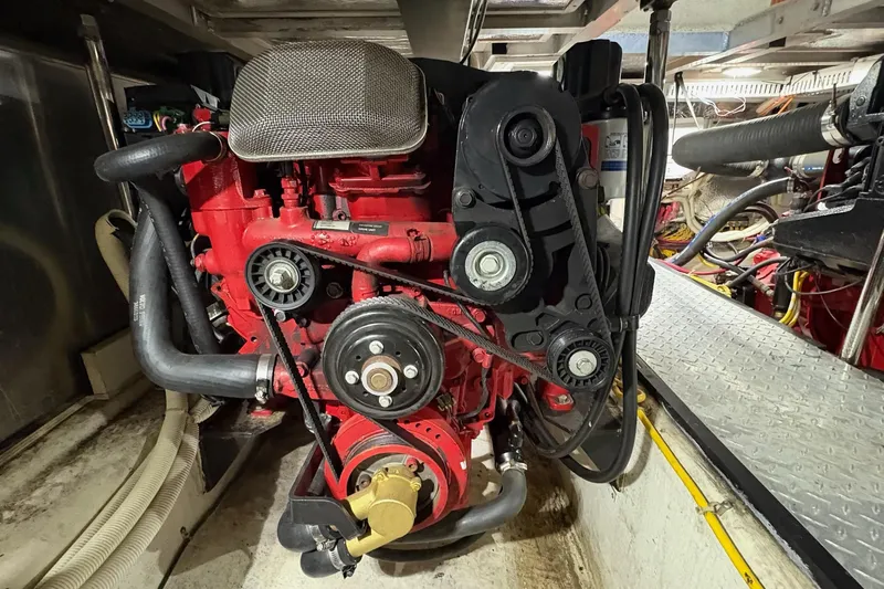  Yacht Photos Pics Engine room of 2003 Carver 396 Motor Yacht, featuring a red marine engine.