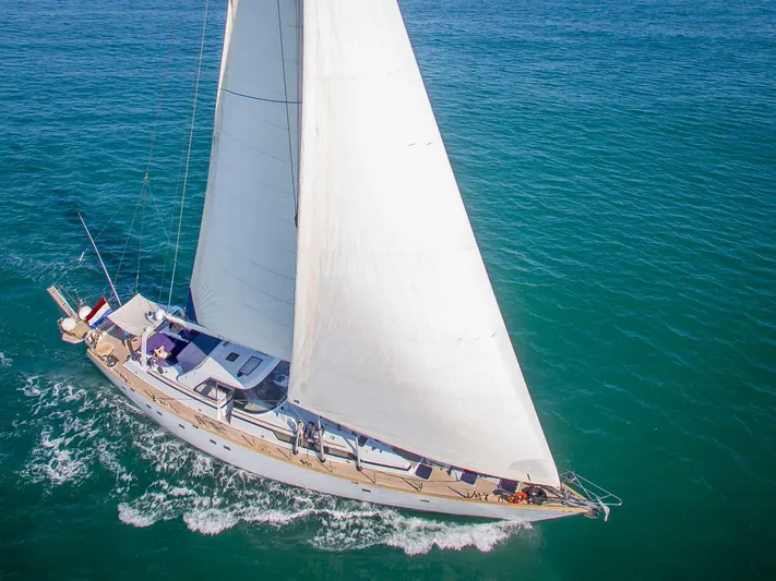  Yacht Photos Pics Sailing yacht CIM Maxi 88 Cutter Sloop, 1991, gliding on open sea with full sails.