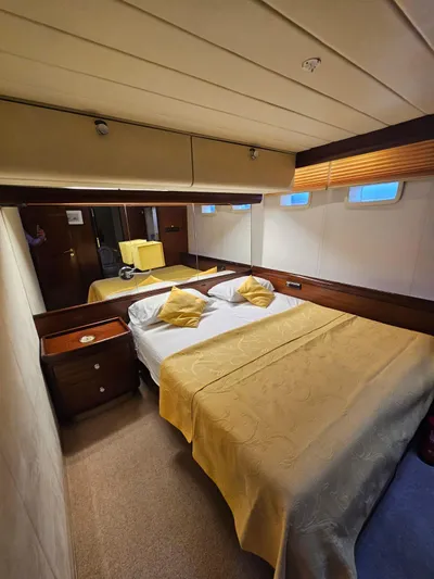  Yacht Photos Pics Luxurious cabin interior of 1991 CIM Maxi 88 Cutter Sloop with cozy bed and elegant decor.