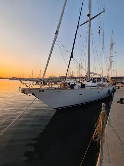  Yacht Photos Pics Sailing yacht CIM Maxi 88 Cutter Sloop, 1991, docked at sunset.