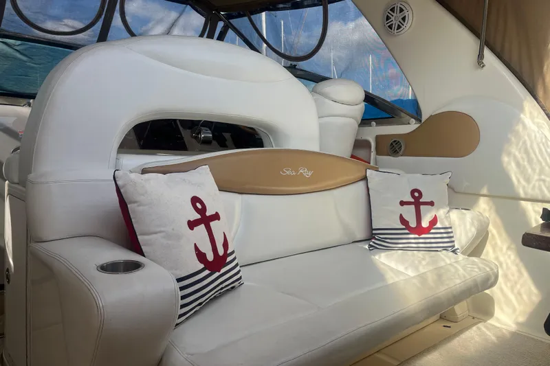  Yacht Photos Pics Interior of 2003 Sea Ray 410 Express Cruiser with nautical-themed cushions.