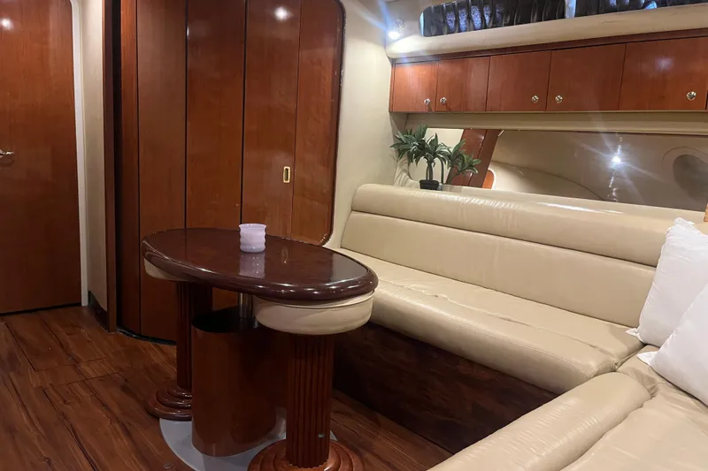  Yacht Photos Pics Luxurious interior of 2003 Sea Ray 410 Express Cruiser with elegant wood and leather seating.