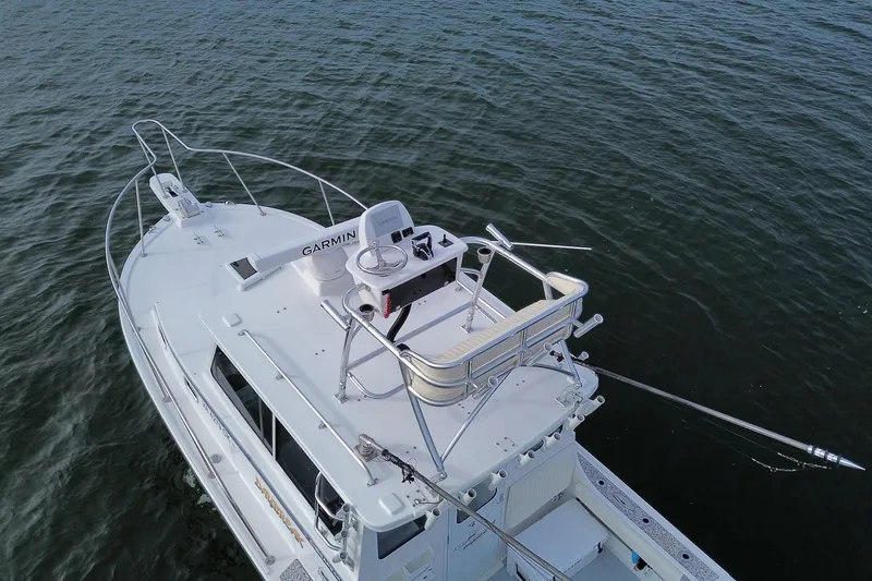 Daybreak Yacht Photos Pics 2023 Steiger Craft 31 Chesapeake boat with Garmin equipment on open water.