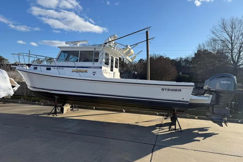 Daybreak Yacht Photos Pics 2023 Steiger Craft 31 Chesapeake boat on stands, featuring Yamaha outboard motor.