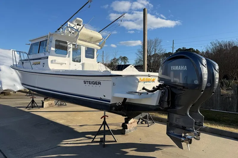 Daybreak Yacht Photos Pics 2023 Steiger Craft 31 Chesapeake boat with dual Yamaha engines on display.