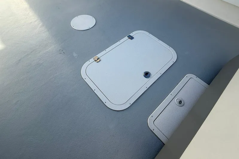 Daybreak Yacht Photos Pics Deck hatches on 2023 Steiger Craft 31 Chesapeake boat, featuring secure latches.