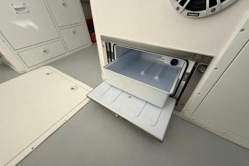 Daybreak Yacht Photos Pics 2023 Steiger Craft 31 Chesapeake boat interior with open storage compartment.