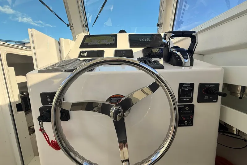 Daybreak Yacht Photos Pics Steiger Craft 31 Chesapeake 2023 helm with steering wheel and control panel.