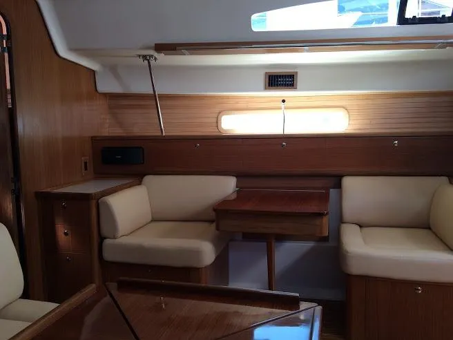 Catalina 425 In Stock Yacht Photos Pics Interior of 2024 Catalina 425 yacht with wooden furnishings and beige seating.