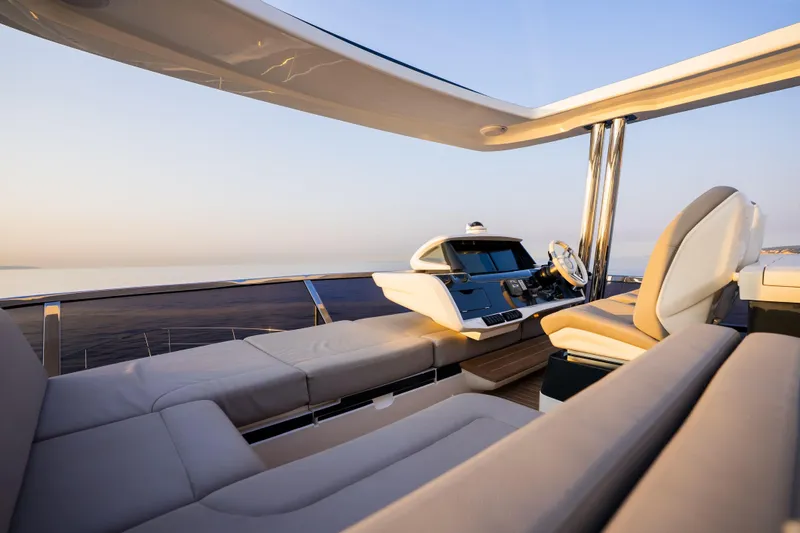 Travitude Yacht Photos Pics Luxurious Pearl 62 yacht interior, 2020 model, featuring elegant seating and modern helm.