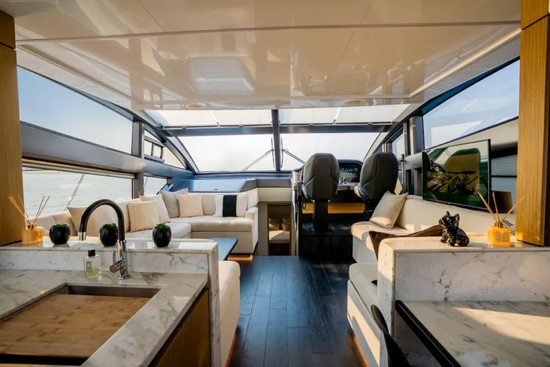 Travitude Yacht Photos Pics Luxurious interior of 2020 Pearl 62 yacht with modern design and elegant furnishings.